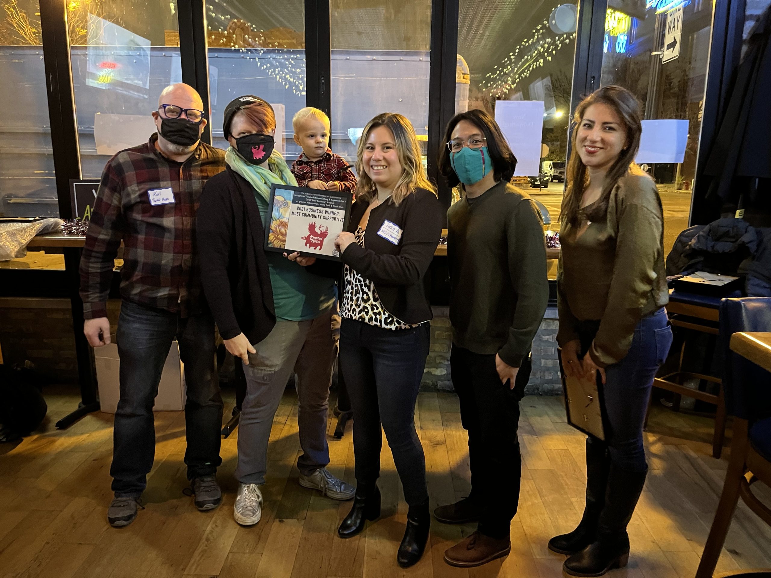 Karl, Marilee, and Finn Rutherford of Twisted Hippo Taproom and Brewery accepting their award for 
Most Community Supportive Business at the 2021 Best Business Bash with Dalia, Benjamin, and Marisabel